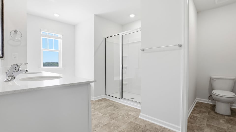 Primary bathroom with double vanity sink.