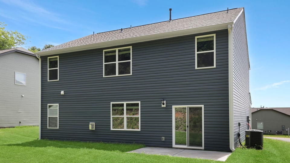 Back exterior with large backyard.