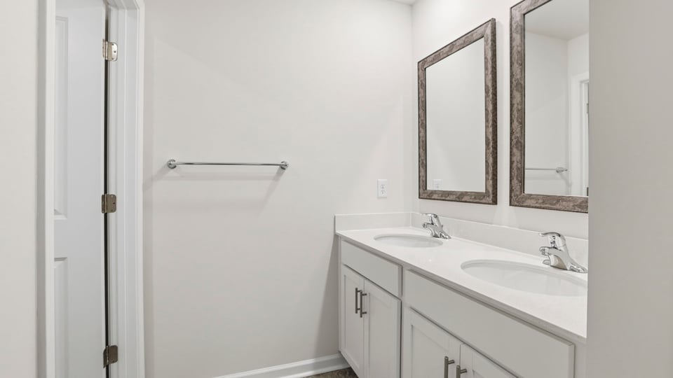 Hall bathroom with dual sink vanity.