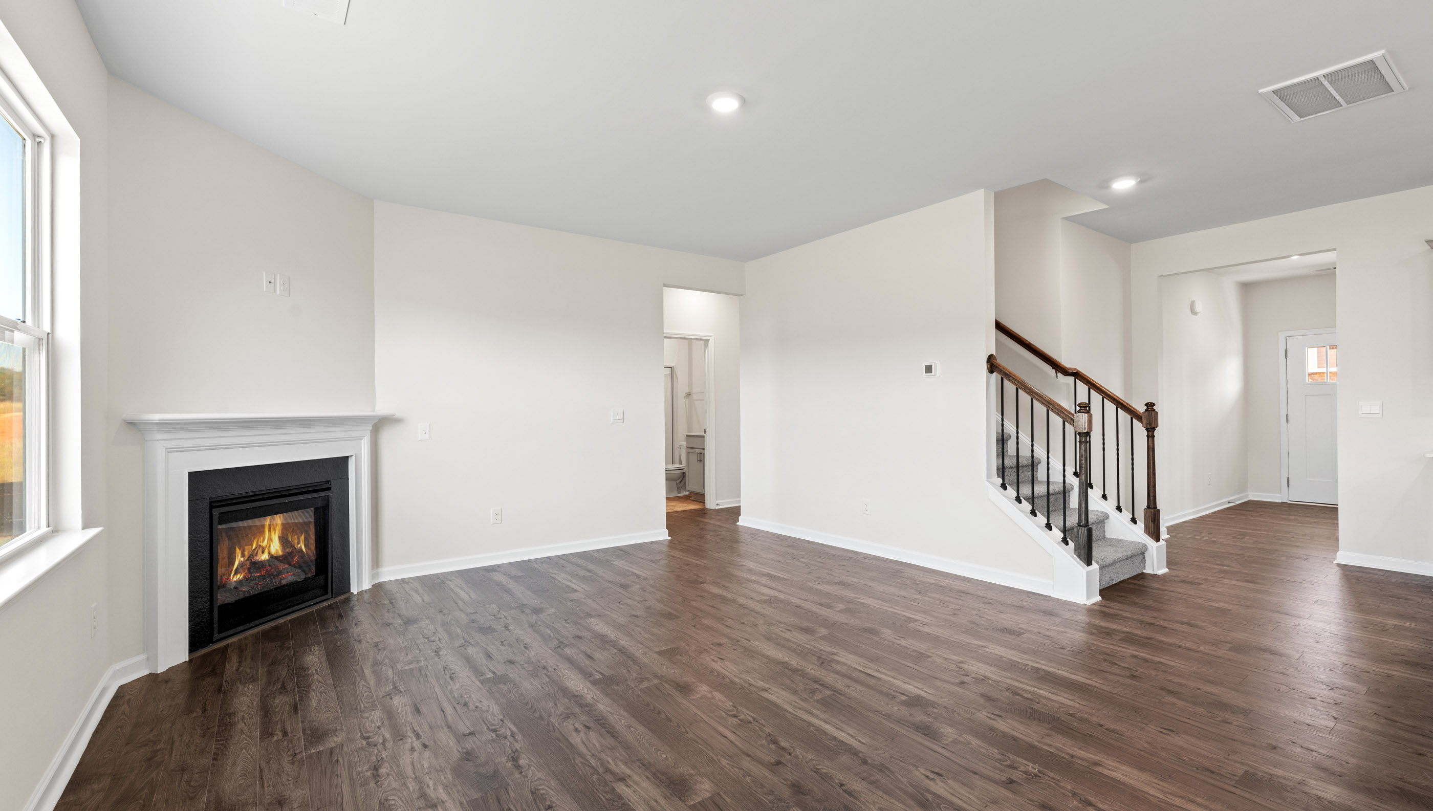 Family room with gas log fireplace.