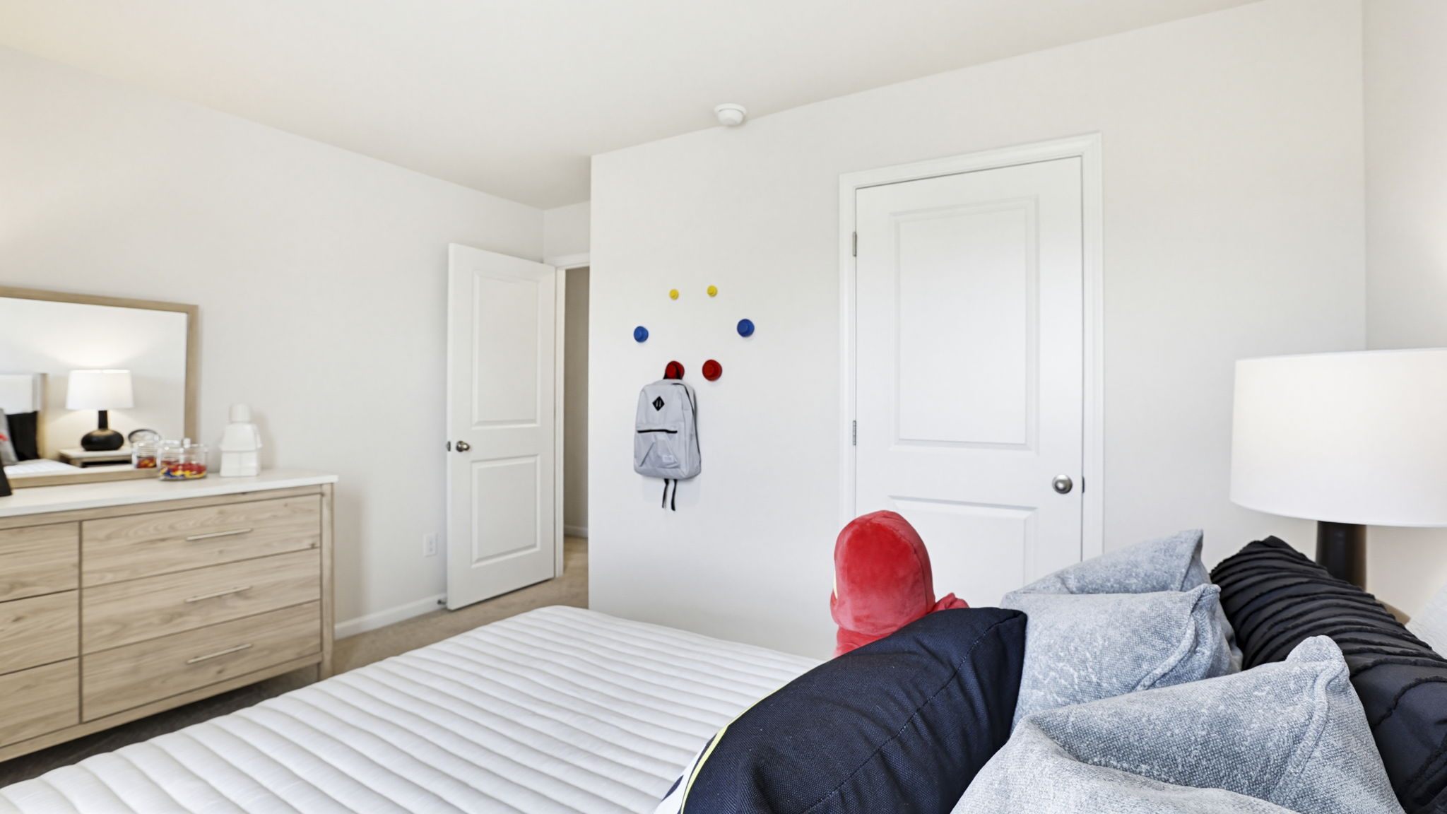 Bedroom with carpet and window.