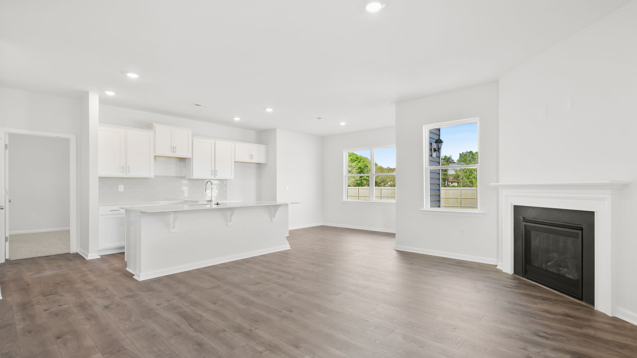 Family room with fireplace and windows.