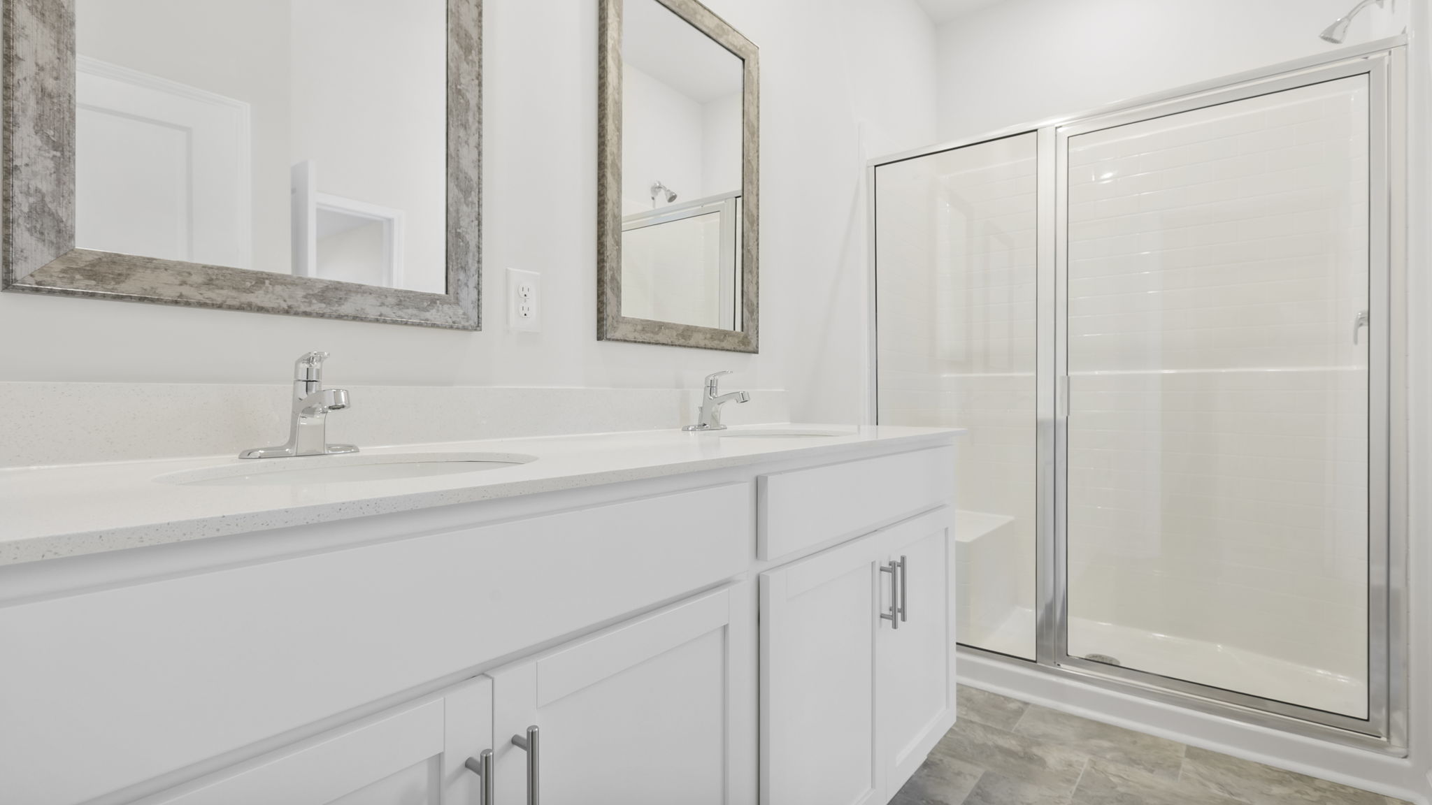 Bathroom with walk in shower and single vanity sink.