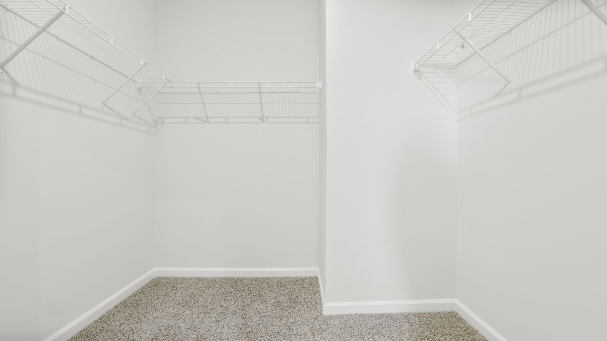 Closet with hanging storage racks.