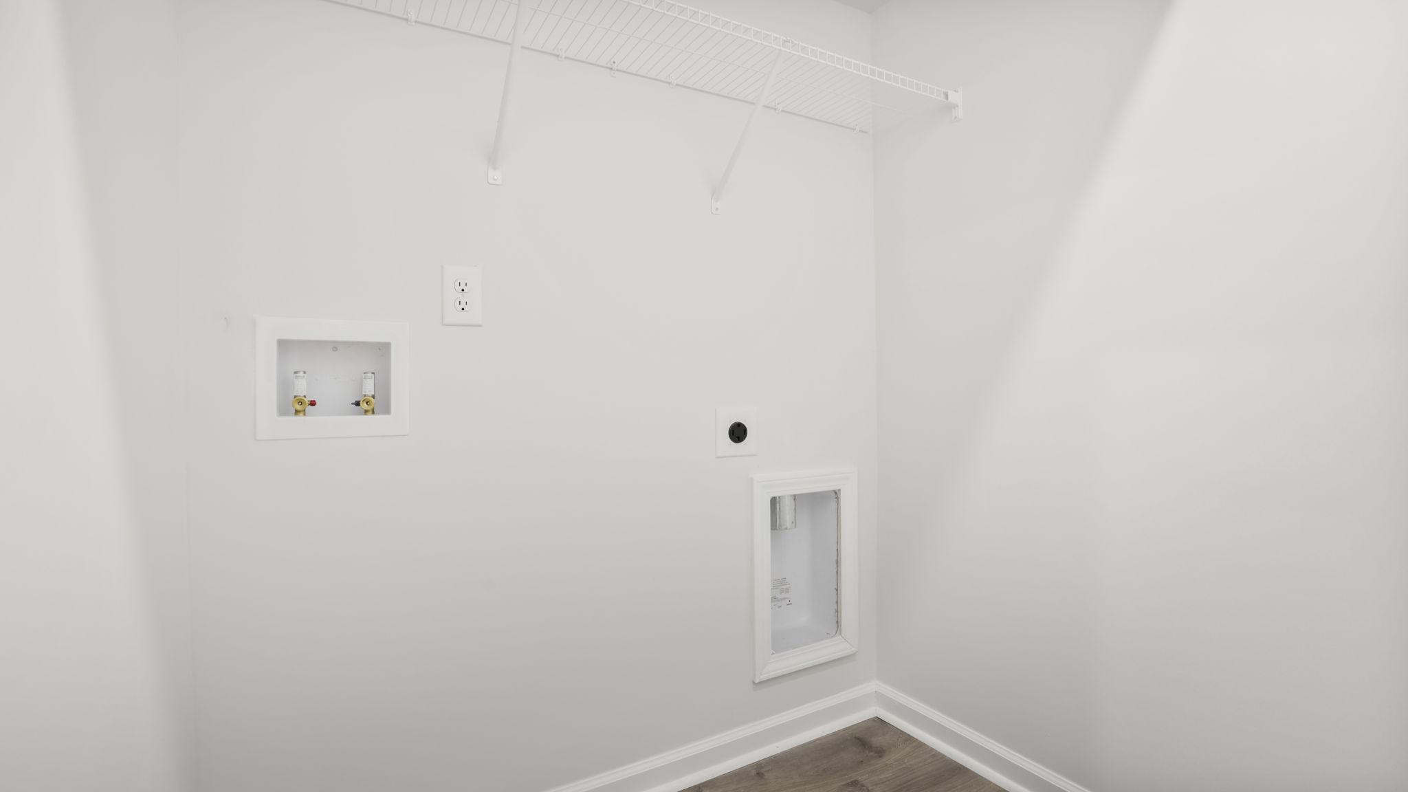 Laundry room with hanging storage racks.