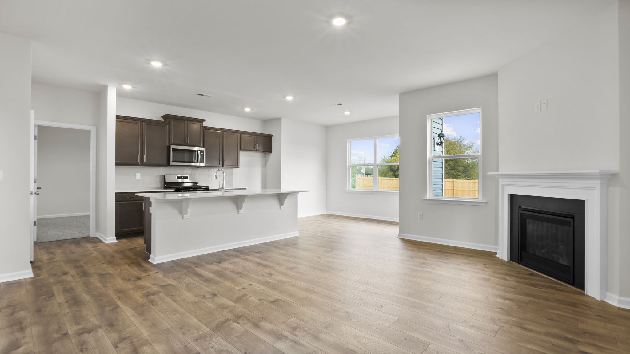 Family room with fireplace and windows.