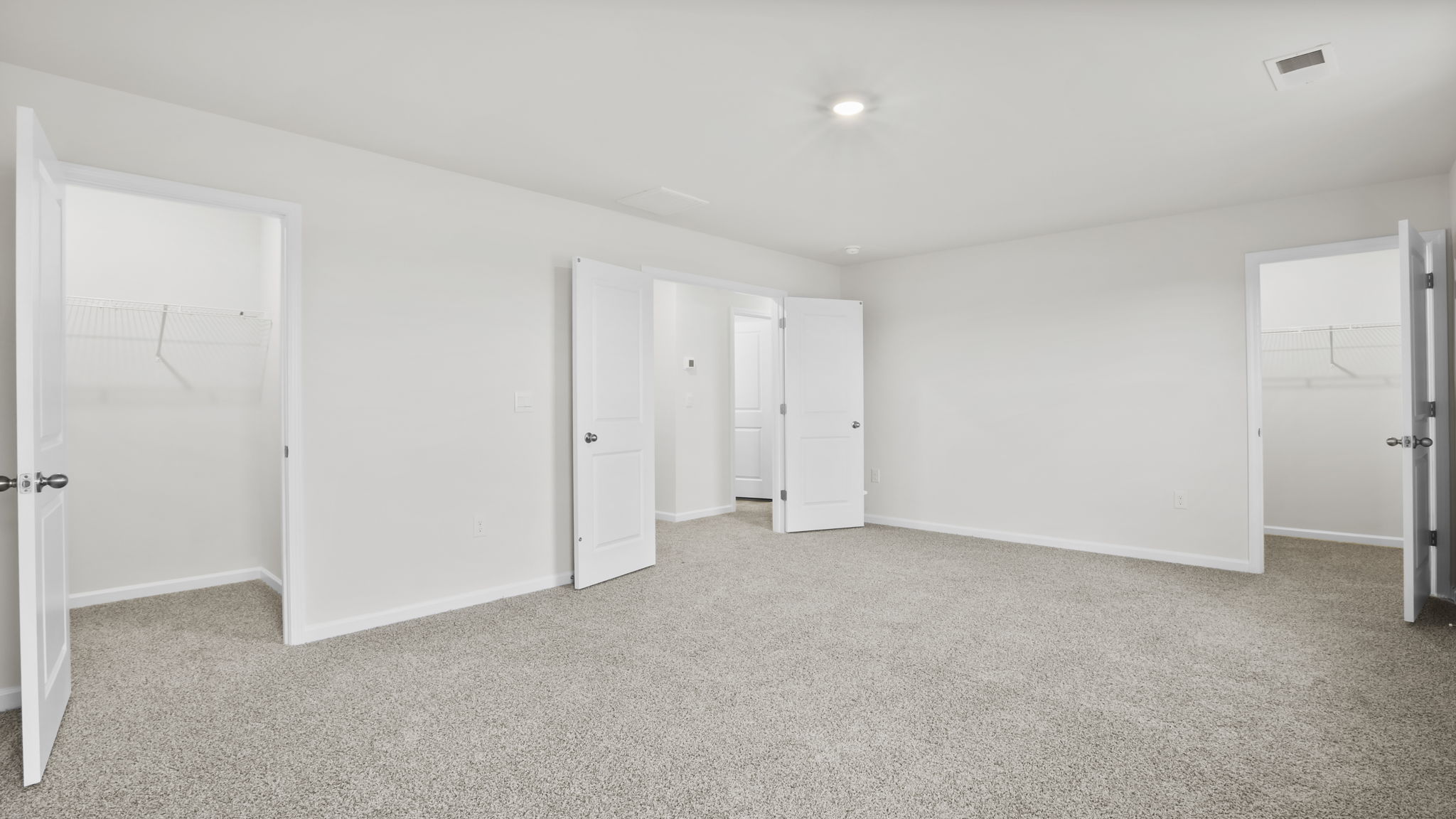 Bedroom with carpet and window.