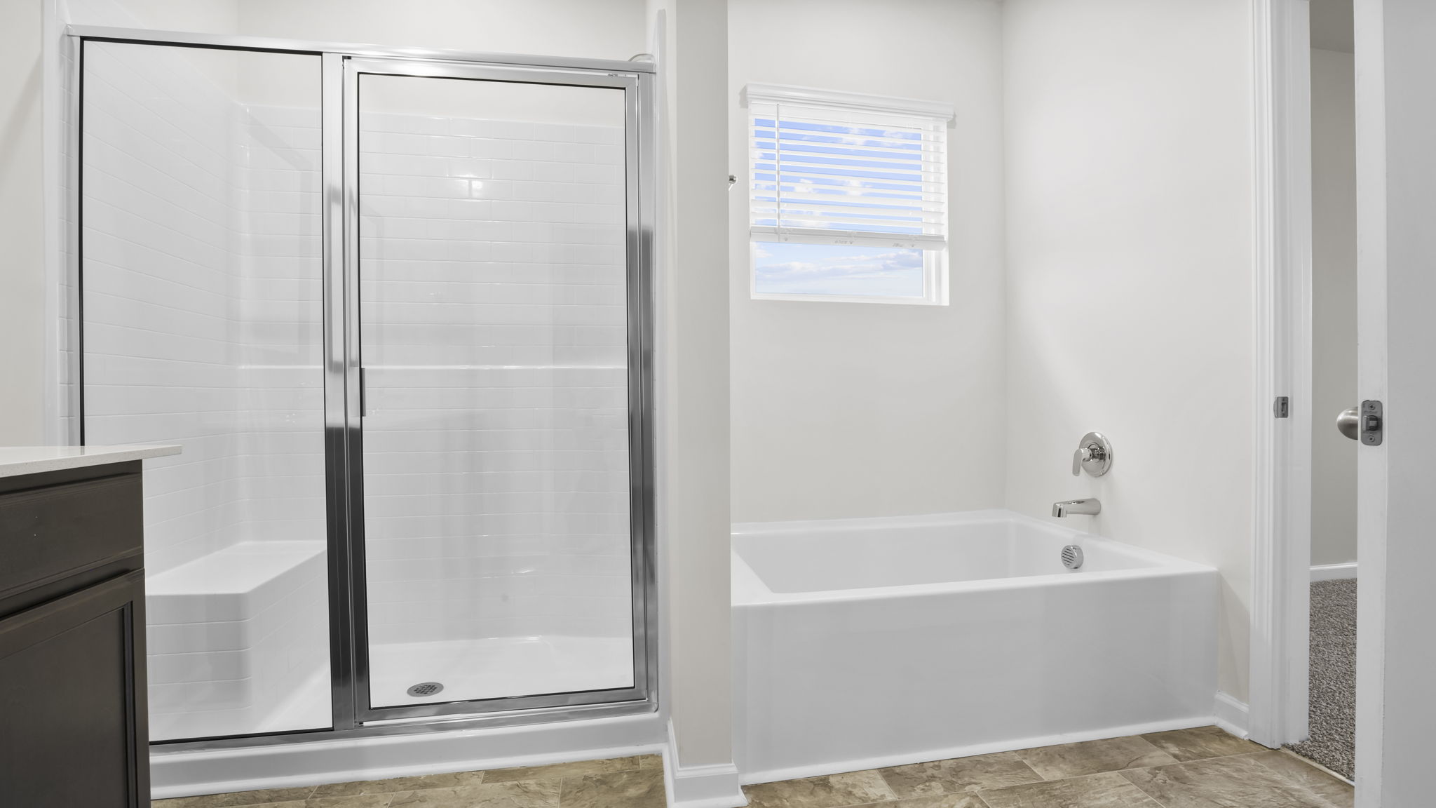 Bathroom with walk in shower and tub.