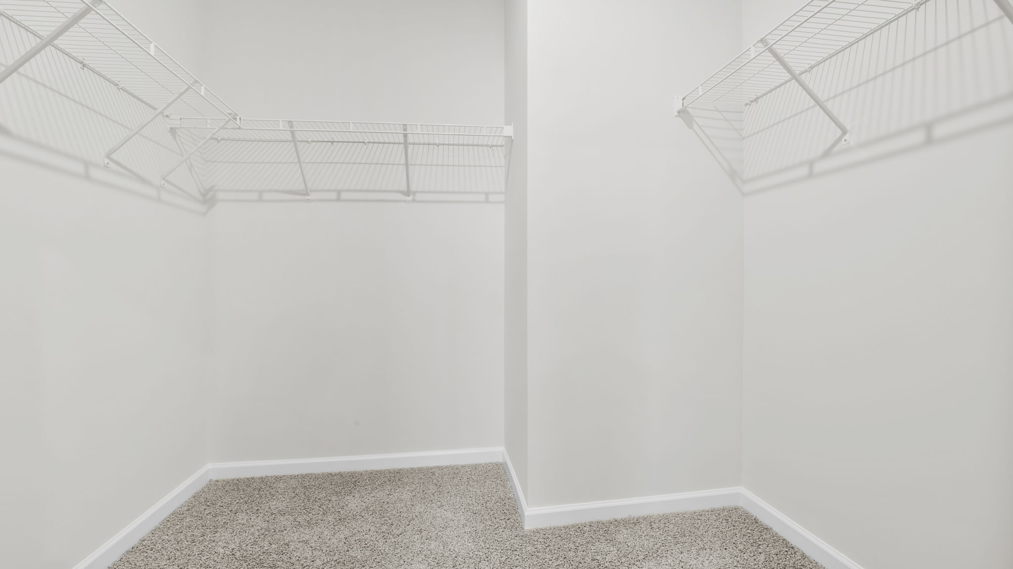 Closet with hanging storage racks.