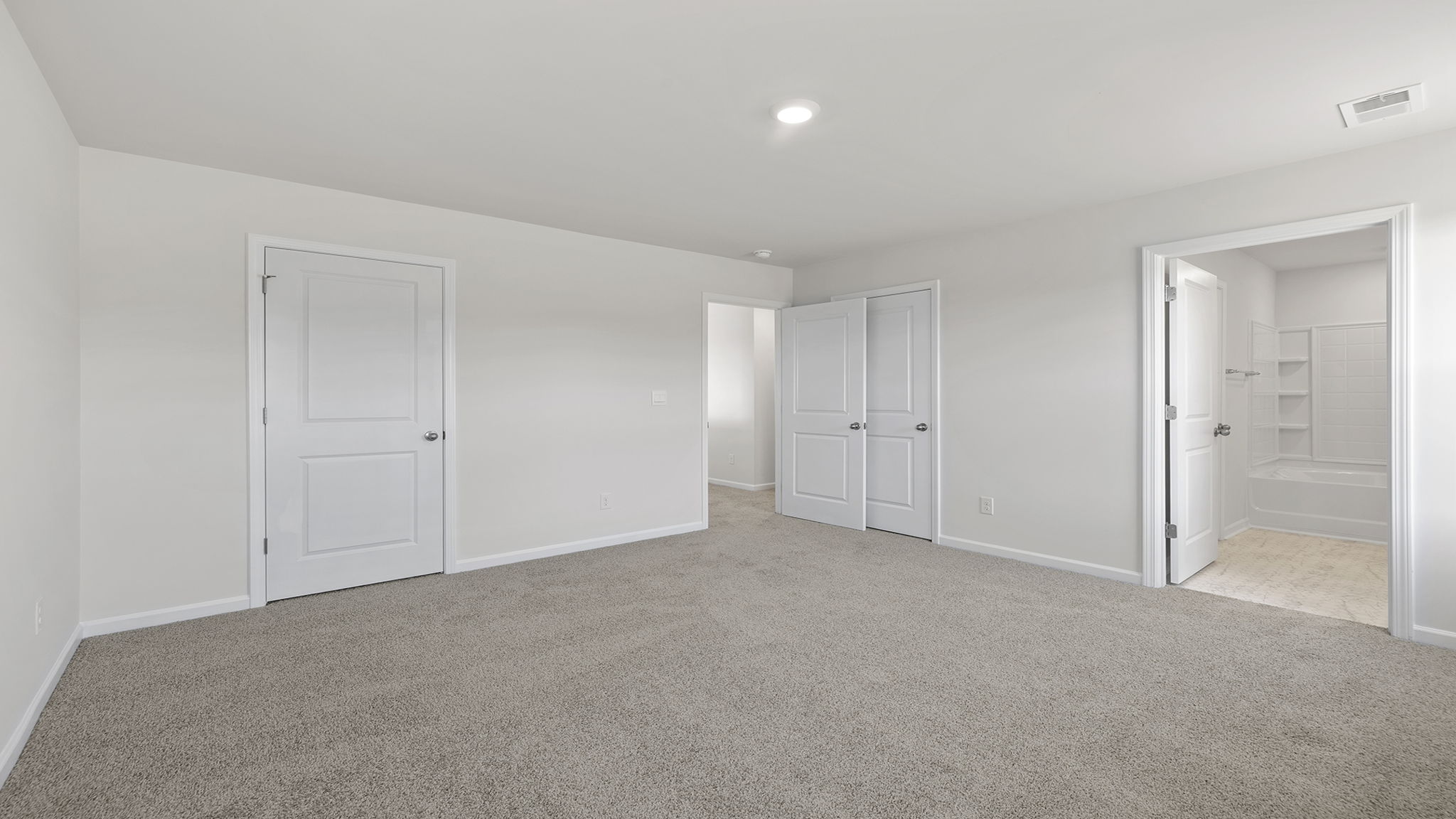 Bedroom with window and carpet.