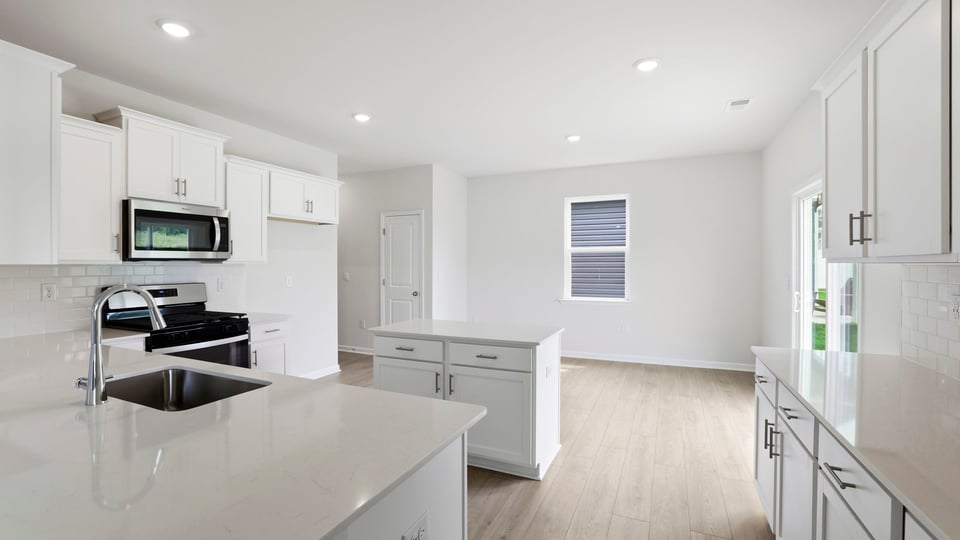 Kitchen with island and cabinets.