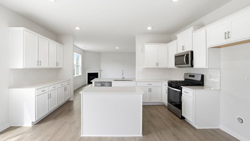Kitchen with island and cabinets.
