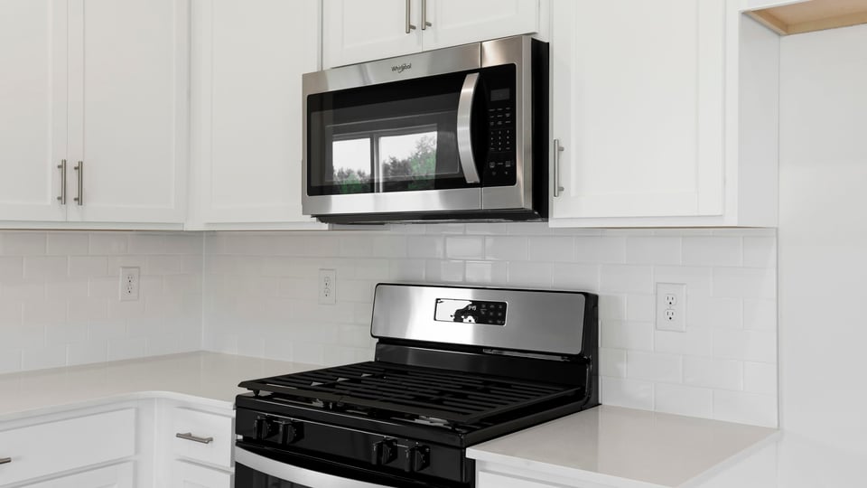 Kitchen with island and cabinets.