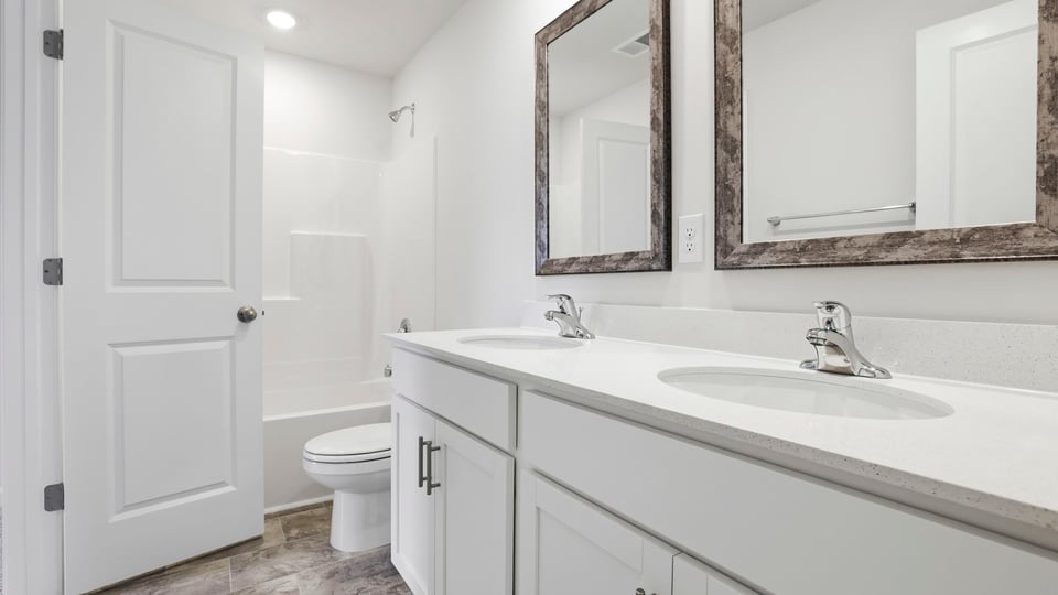 Bathroom with double vanity sinks.