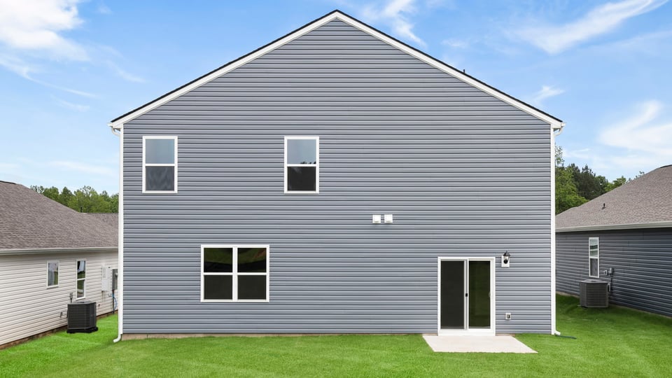 Back exterior with large backyard.
