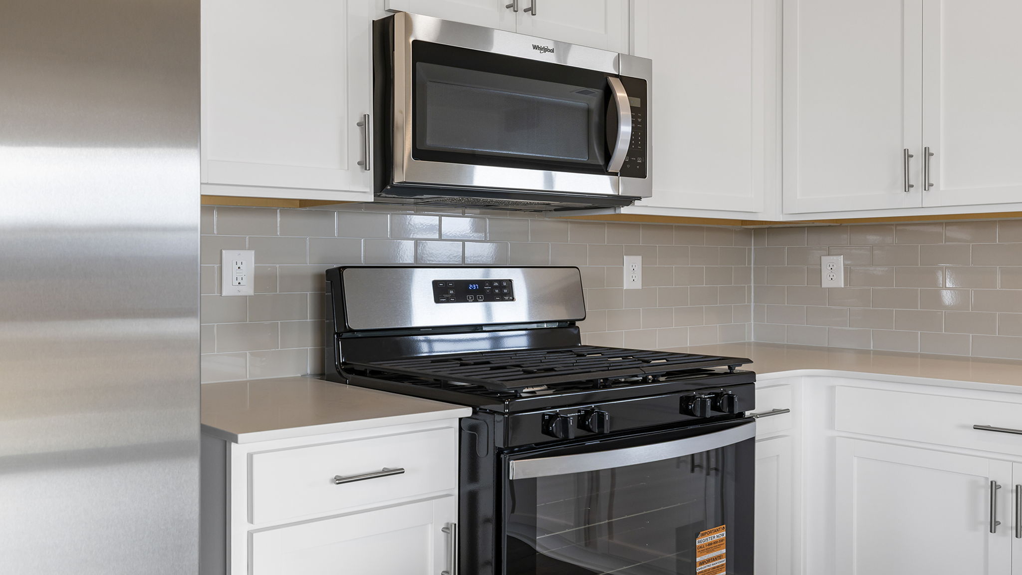 Kitchen features stainless steel appliances.