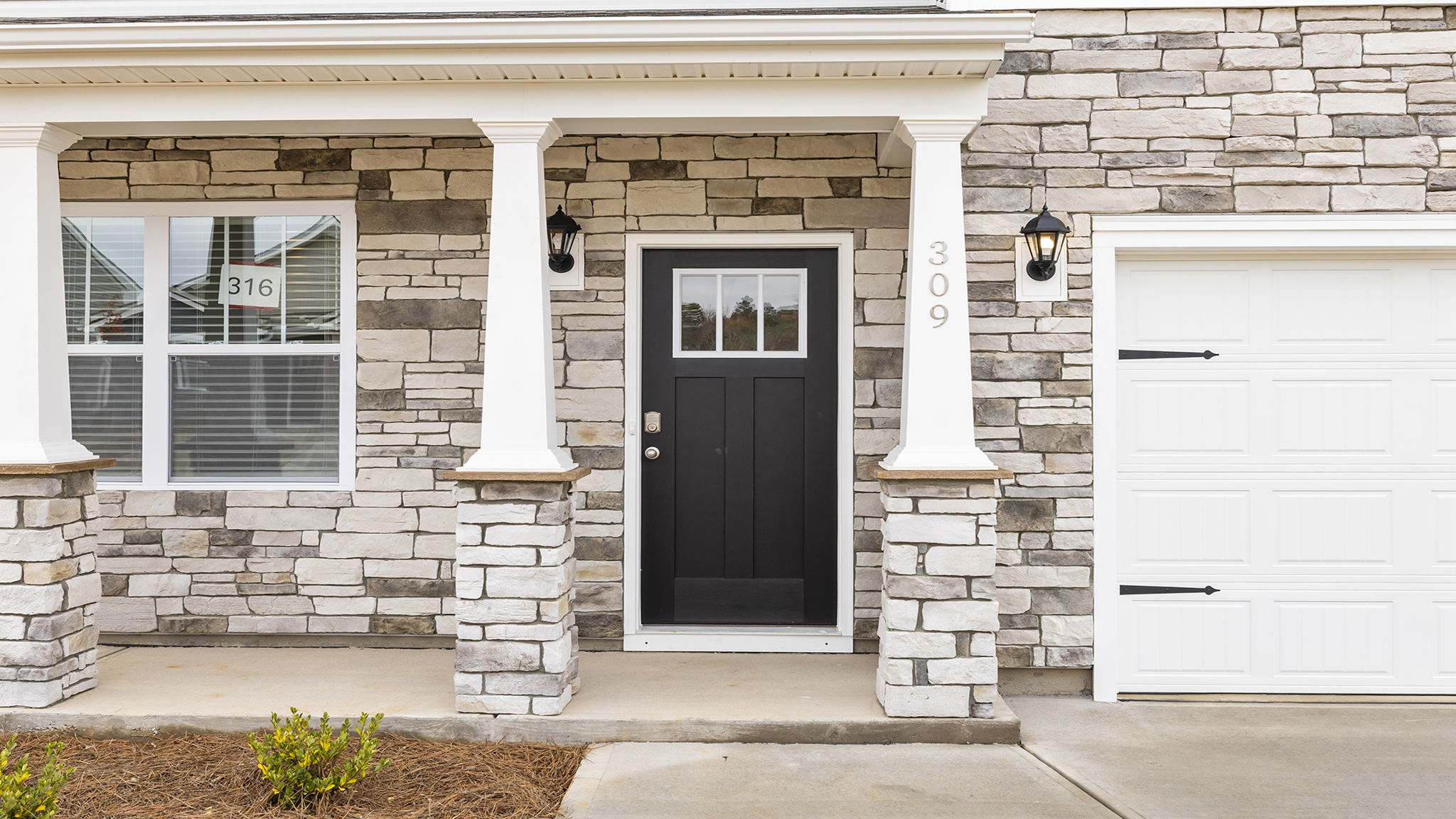 Inviting entry with stone accents.