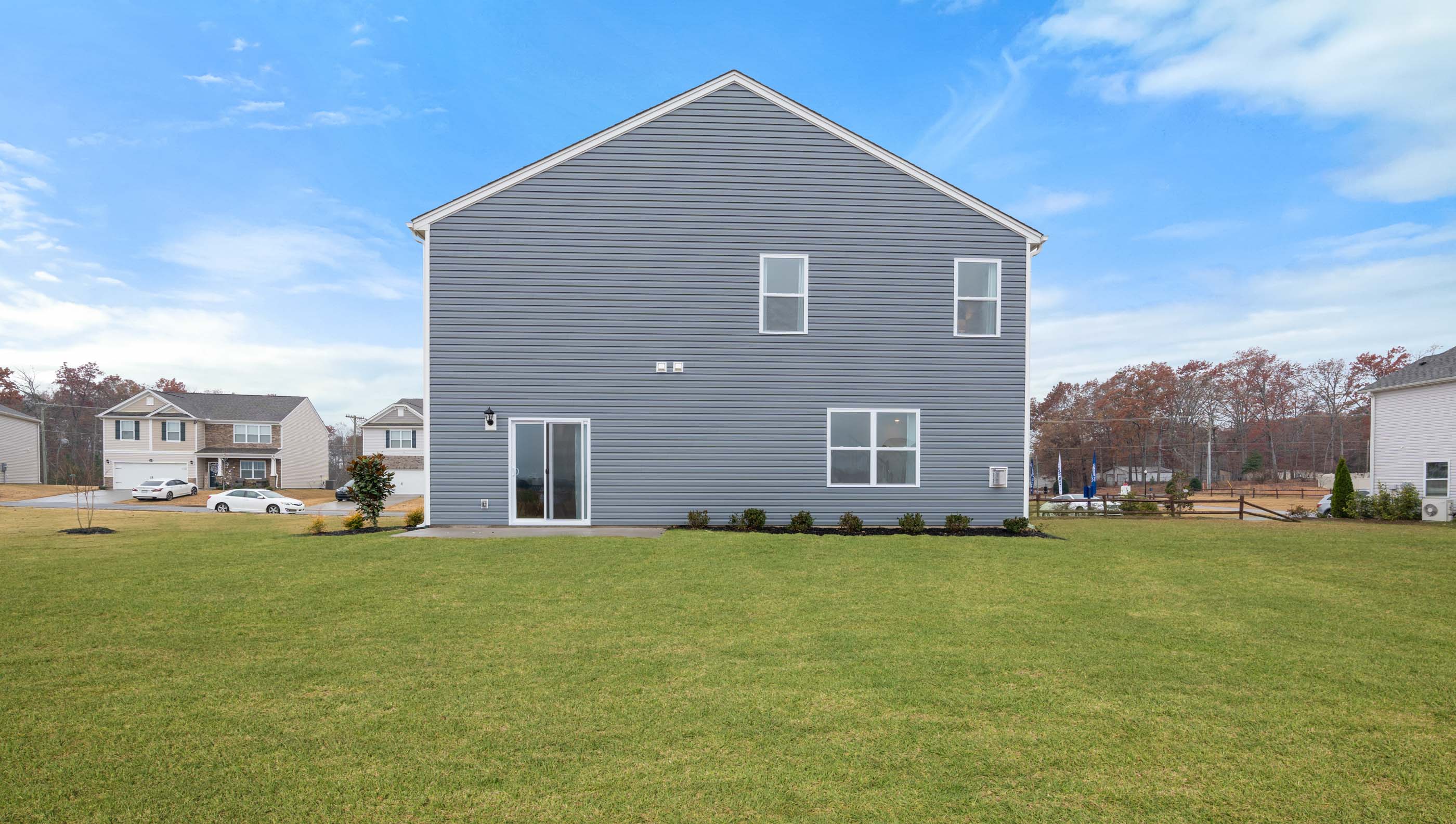 Back exterior with large backyard.