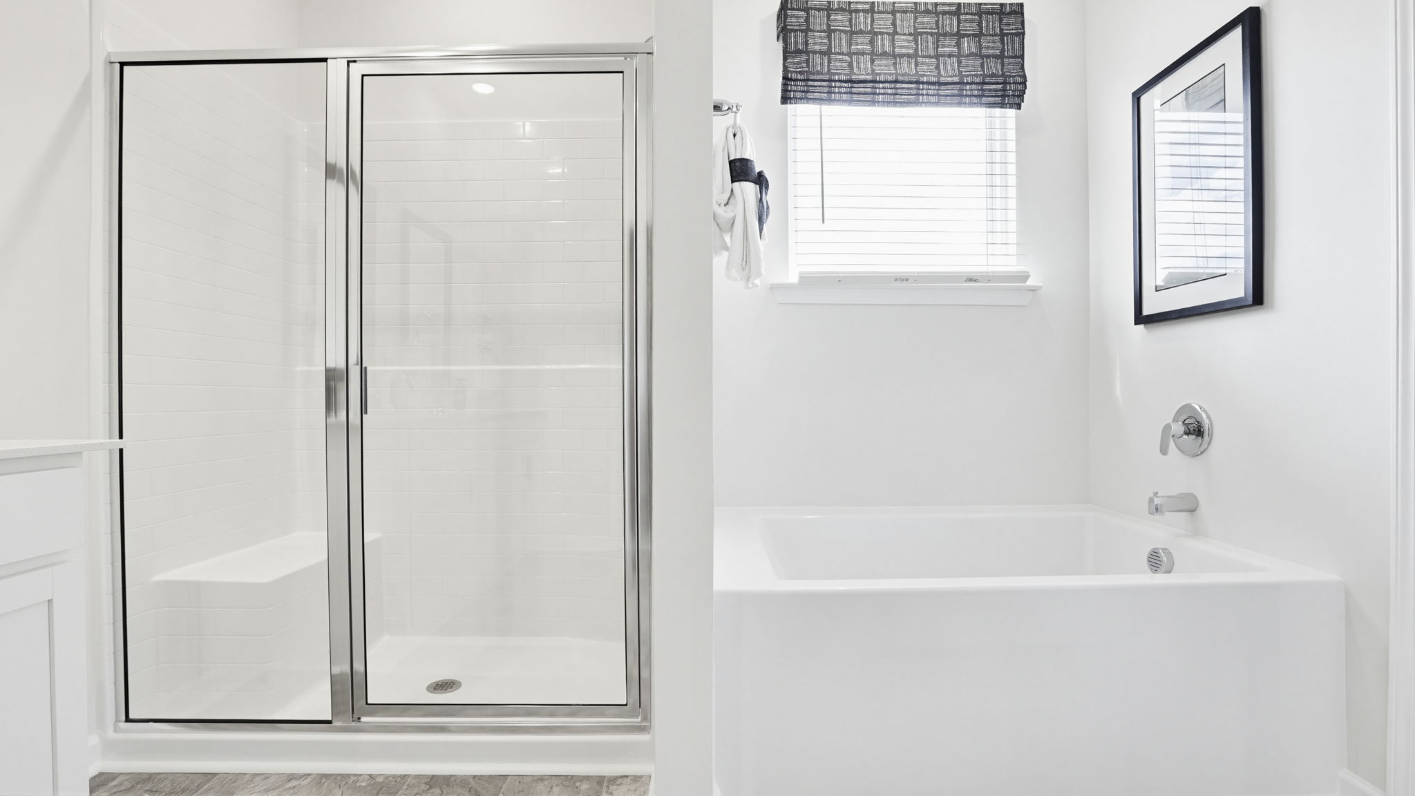 Bathroom with tub and walk in shower.