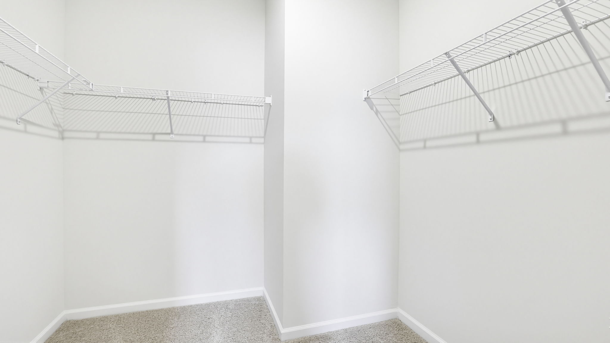 Closet with hanging storage racks.