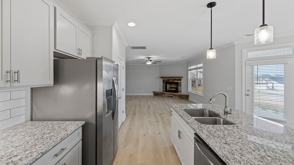 Kitchen and island with granite counter tops.