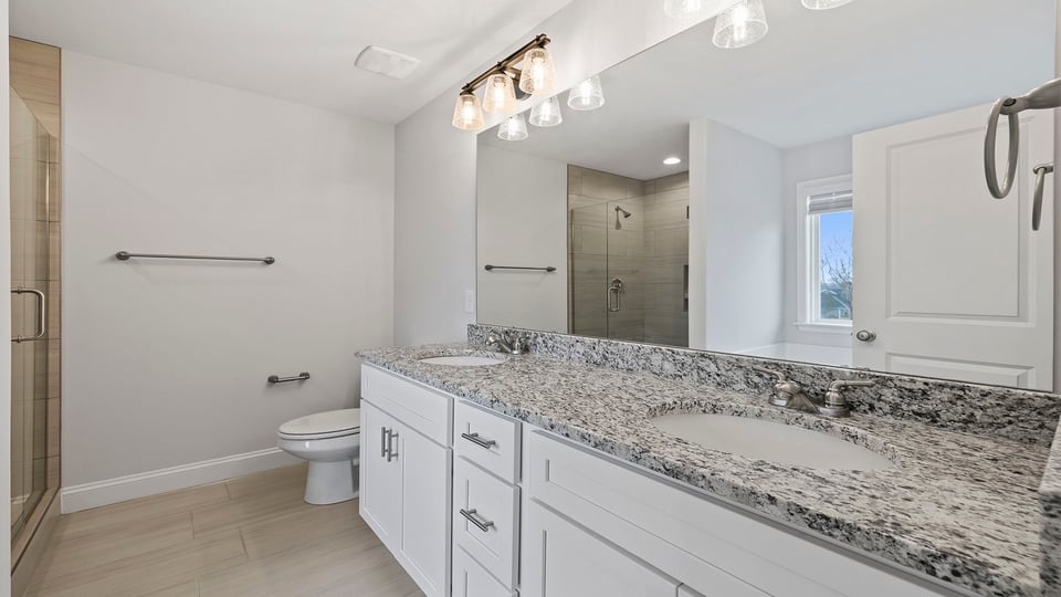 Bathroom with dual vanity.