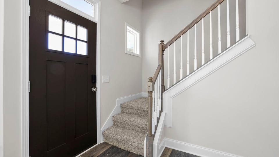 Family room with fireplace and window.