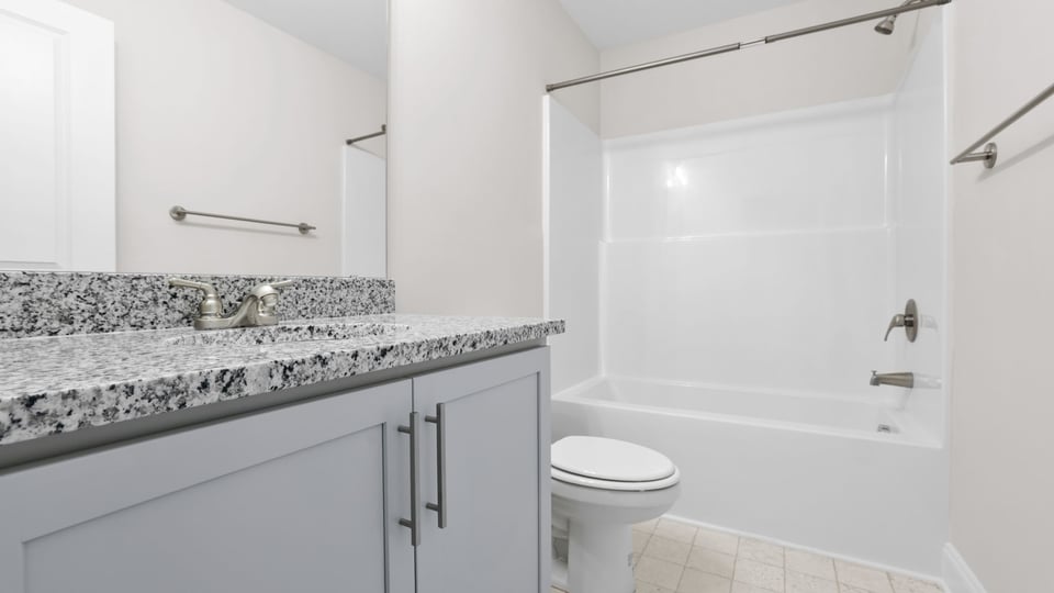 Bathroom with sink and shower.