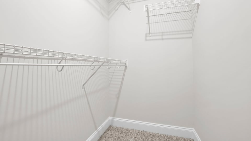 Closet with hanging storage racks.
