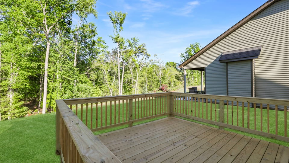 Back exterior of home with porch.