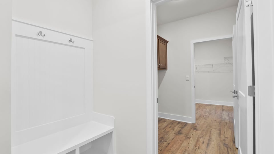 Hallway with storage shelves.
