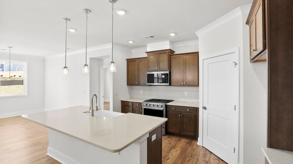 Kitchen with island and cabinets.