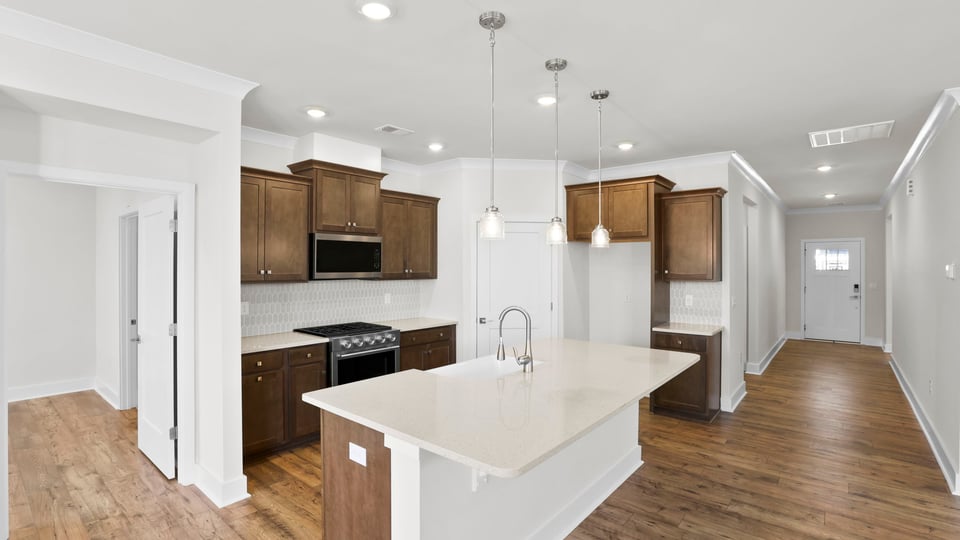 Kitchen with island and cabinets.