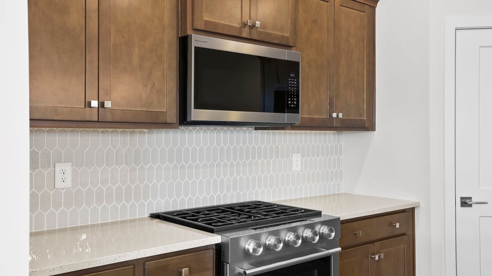 Kitchen with island and cabinets.