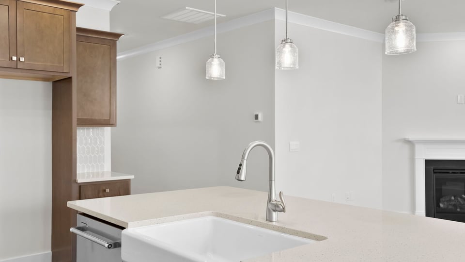 Kitchen with island and cabinets.