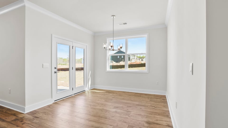Living area with fireplace and windows.