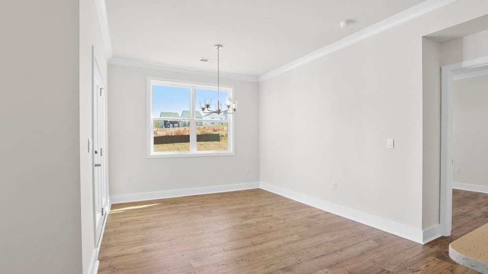 Living area with fireplace and windows.