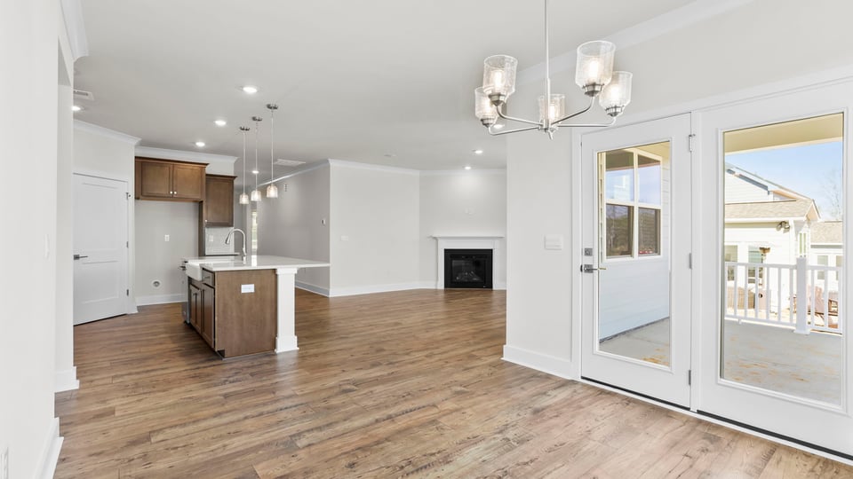 Living area with fireplace and windows.