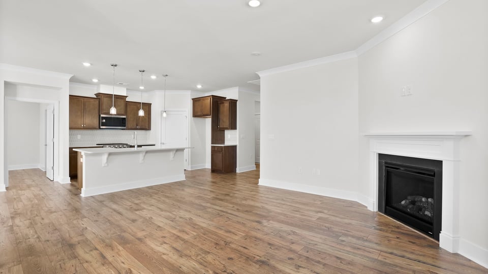 Living area with fireplace and windows.