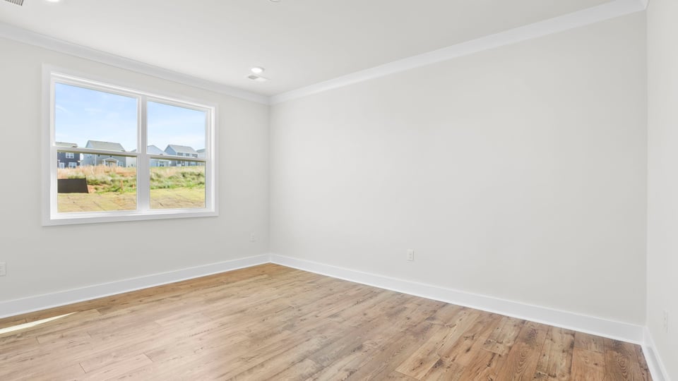 Primary bedroom with windows.