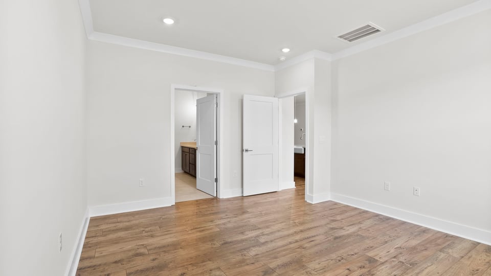 Primary bedroom with windows.