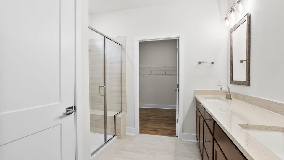 Primary bathroom with double vanity sinks.