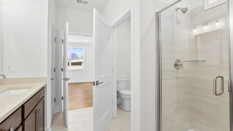 Primary bathroom with double vanity sinks.