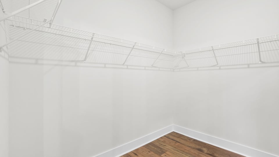 Primary closet with shelf.