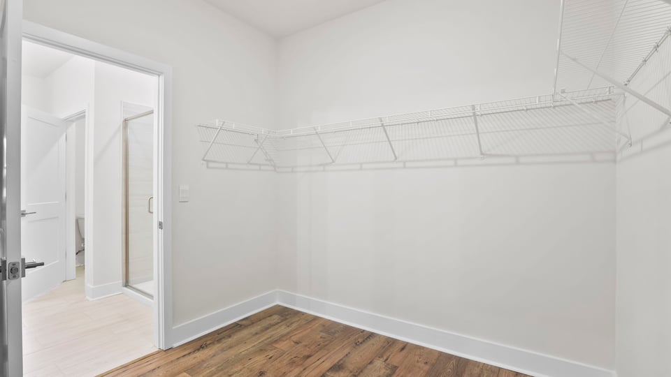 Primary closet with shelf.