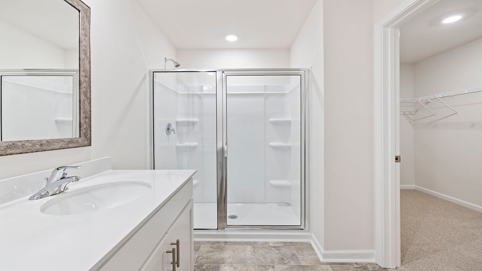 Primary bathroom with double vanity sinks.
