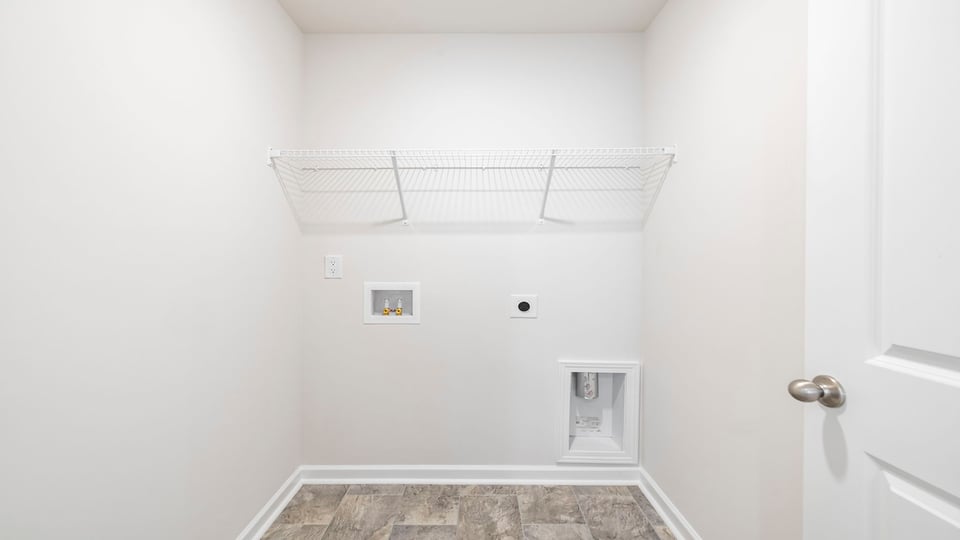 Laundry room with shelf.