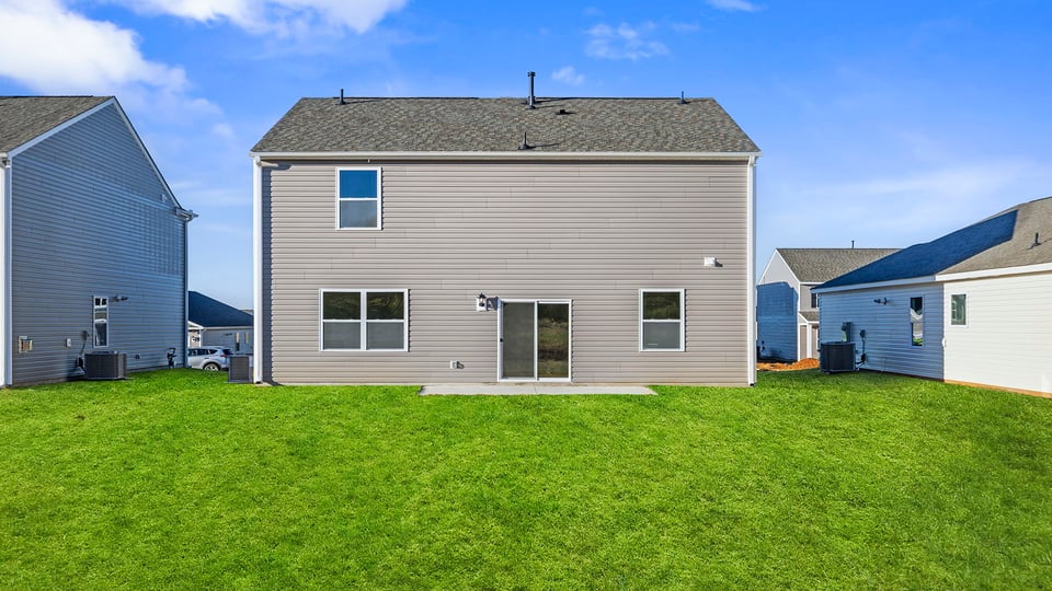 Back exterior with large backyard.