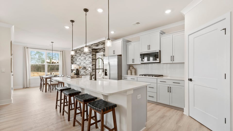 Kitchen to island and cabinets.