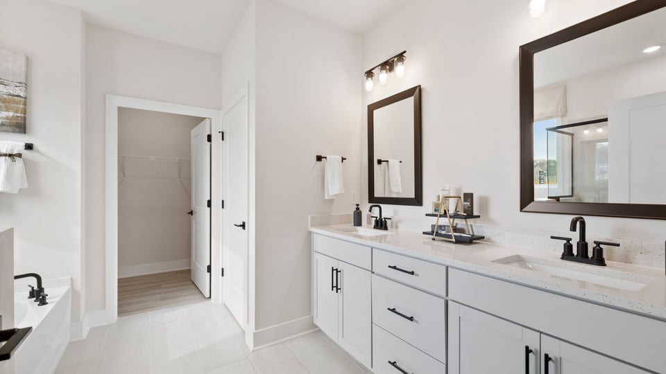 Primary bathroom with double vanity sinks.